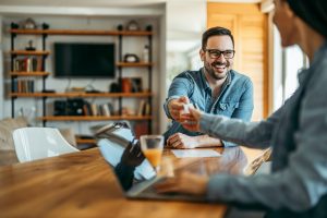 Couple shopping online at home.